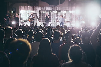 Live Concert Crowd with Band Performing on Stage