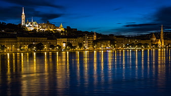 Budapest skyline at night with Danube river reflections