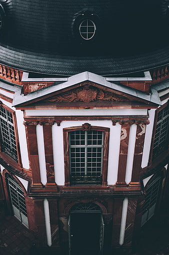 Low angle view of historic red sandstone building facade