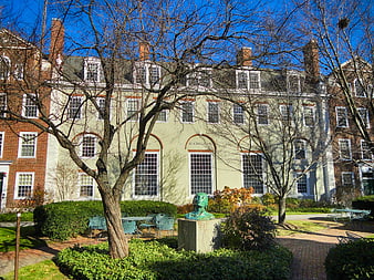 Harvard Business School Campus Building With Sculpture And Trees