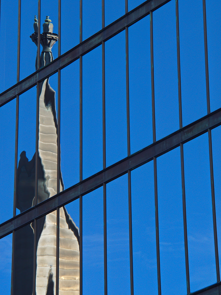 Reflection of Washington Monument in Modern Glass Building