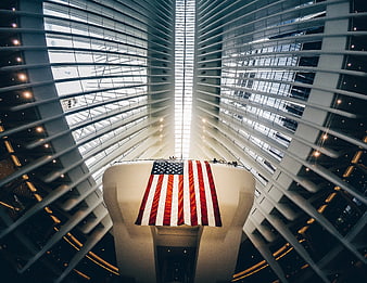 American Flag Hanging in Modern Architectural Atrium