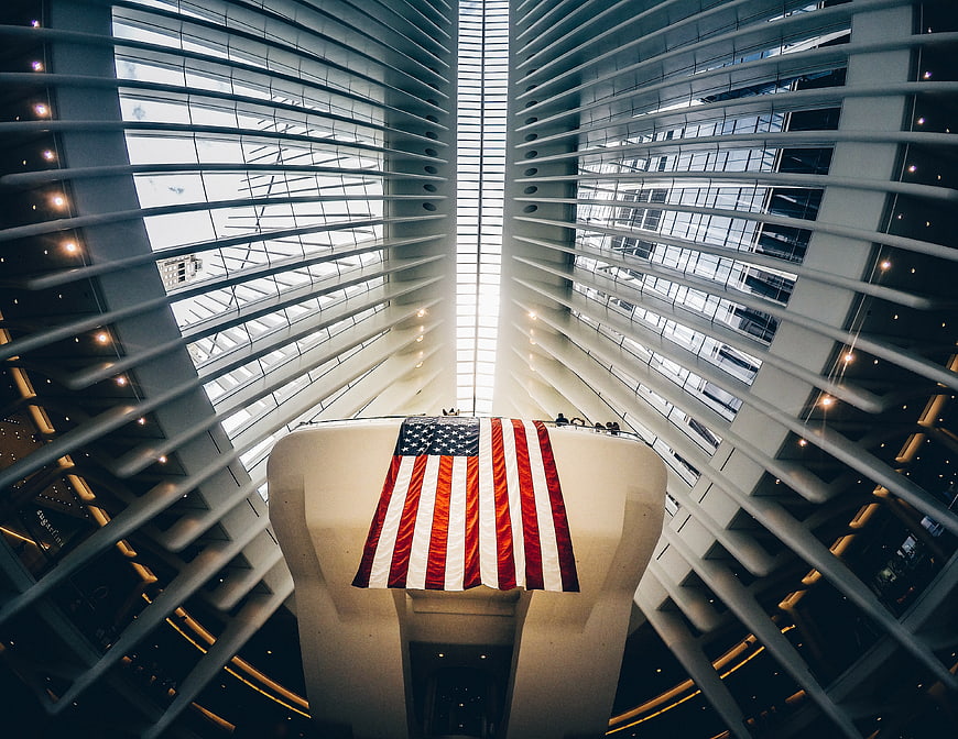 American Flag Hanging in Modern Architectural Atrium