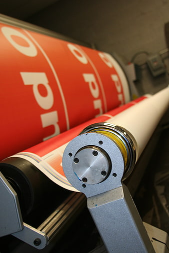Large Format Printer Printing Red Vinyl Banner