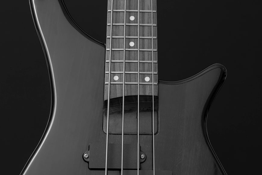 Close-up of Black Electric Bass Guitar Neck and Body