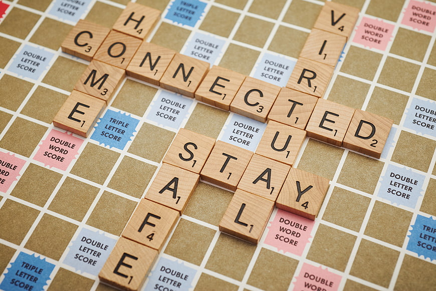 Scrabble Tiles Spelling Stay Connected on Game Board