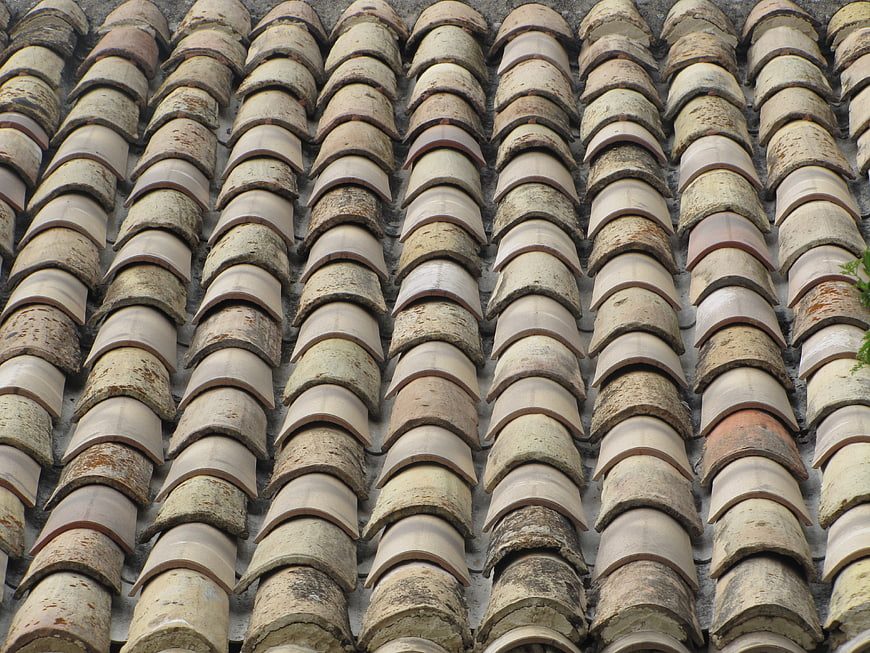 Close-up of weathered terracotta roof tiles pattern