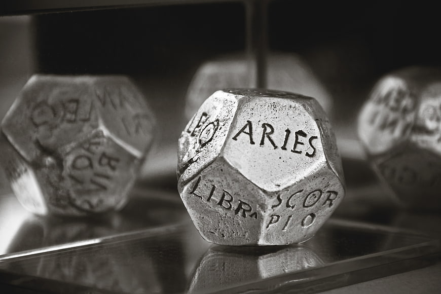 Close-up of Zodiac Sign Dice with Aries in Focus