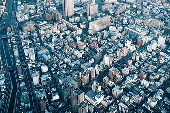 Aerial View of Dense Urban Cityscape with Highway and River