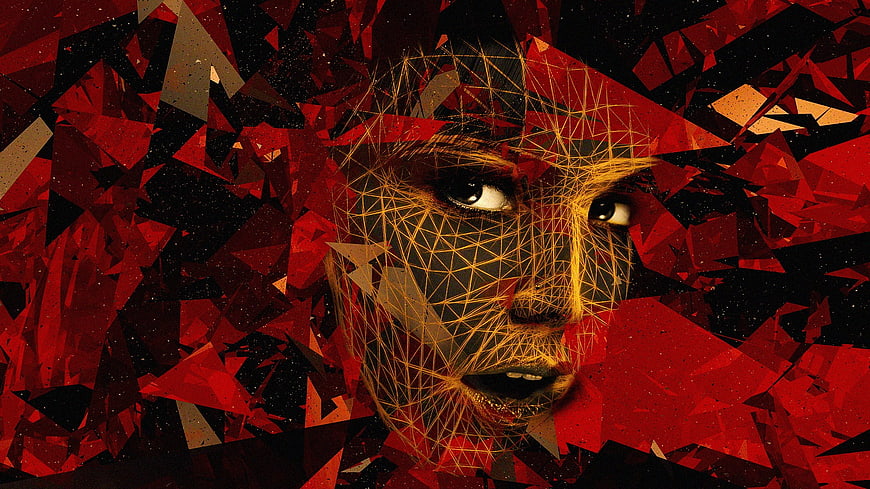 Abstract digital art of a woman's face with red geometric shards