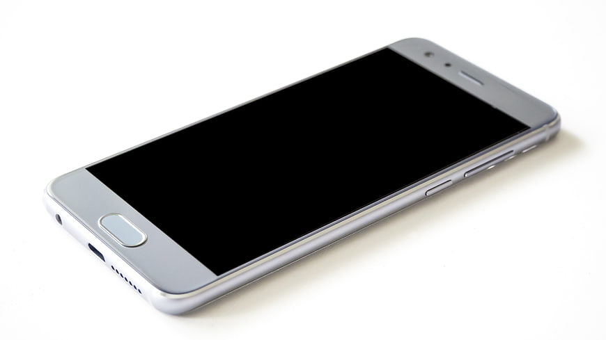 Silver Smartphone with Black Screen on White Background