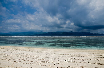 Tropical Beach Landscape with Turquoise Water and Cloudy Sky