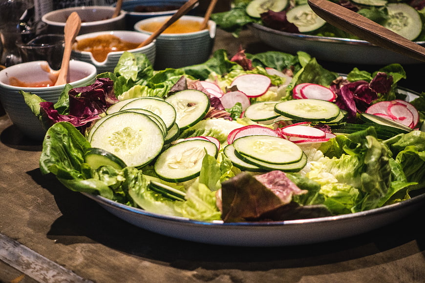 Fresh vegetable salad with cucumber and radish slices
