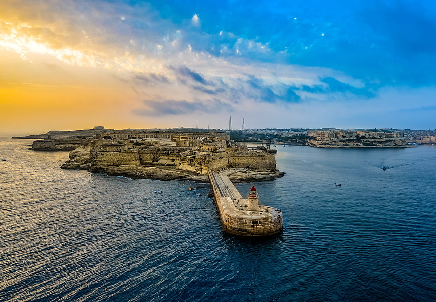 Aerial View of Valletta Harbor and Lighthouse at Sunrise in Malta
