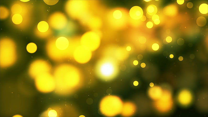 Abstract yellow bokeh lights on dark green background