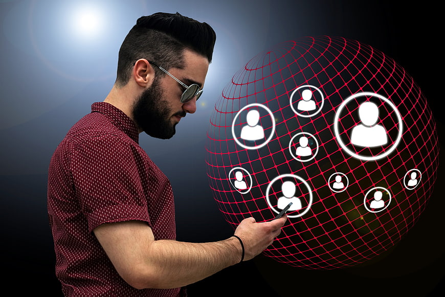 Man Using Smartphone With Social Network Globe Concept