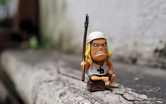 Cute Anime Warrior Figurine Holding Spear On Weathered Wood