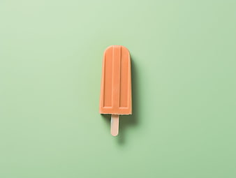 Orange Popsicle on Mint Green Background