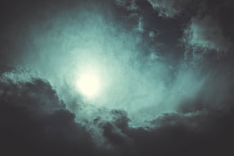 Dramatic Dark Storm Clouds With Bright Sunlight Breaking Through