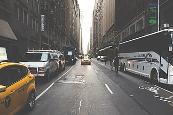 Busy New York City Street with Yellow Taxi and Tour Bus