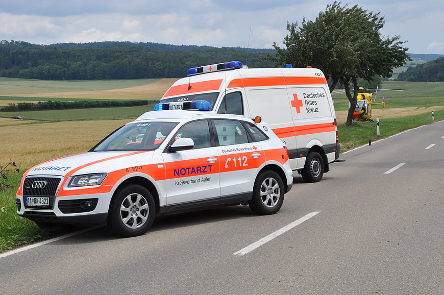 German Red Cross Ambulance and Doctor Car on Rural Road
