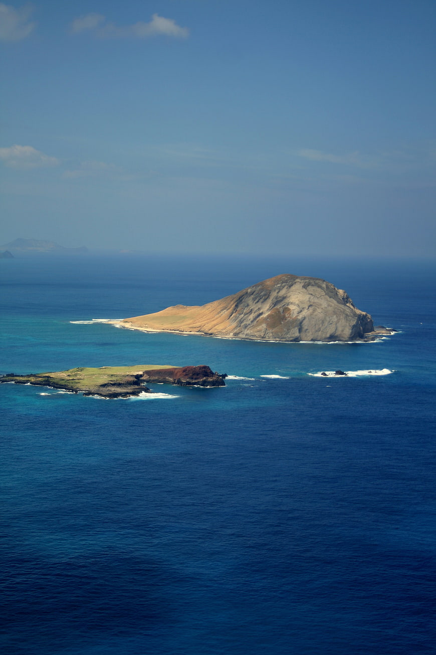 Aerial View of Rocky Island in Blue Ocean