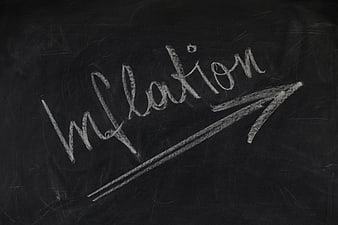 Inflation written on blackboard with upward arrow