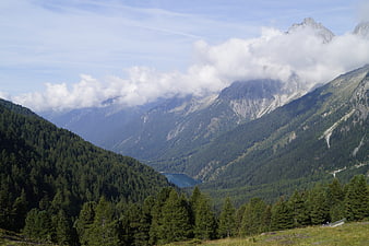 Scenic Dolomites Mountain Landscape With Alpine Lake And Clouds