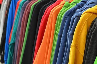 Colorful Hoodies Hanging on Rack in Clothing Store