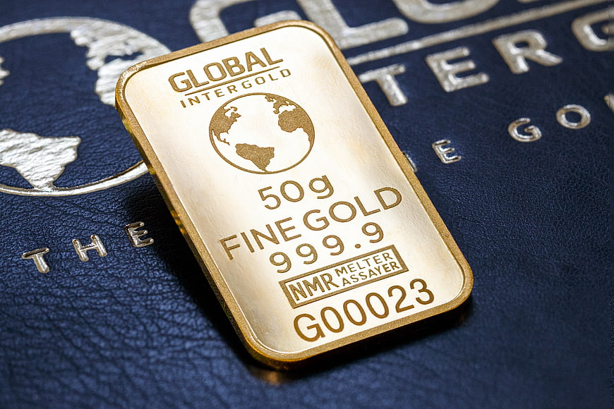 50g Gold Bar on Blue Certificate Background