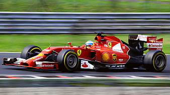 Red Ferrari Formula 1 Race Car Speeding on Track