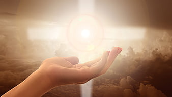 Hand Reaching for Divine Light in Clouds