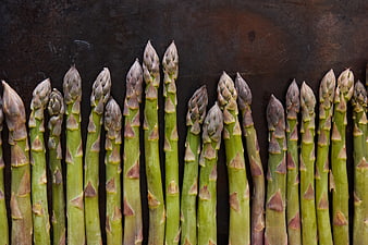 Fresh Green Asparagus Stalks on Dark Rustic Background