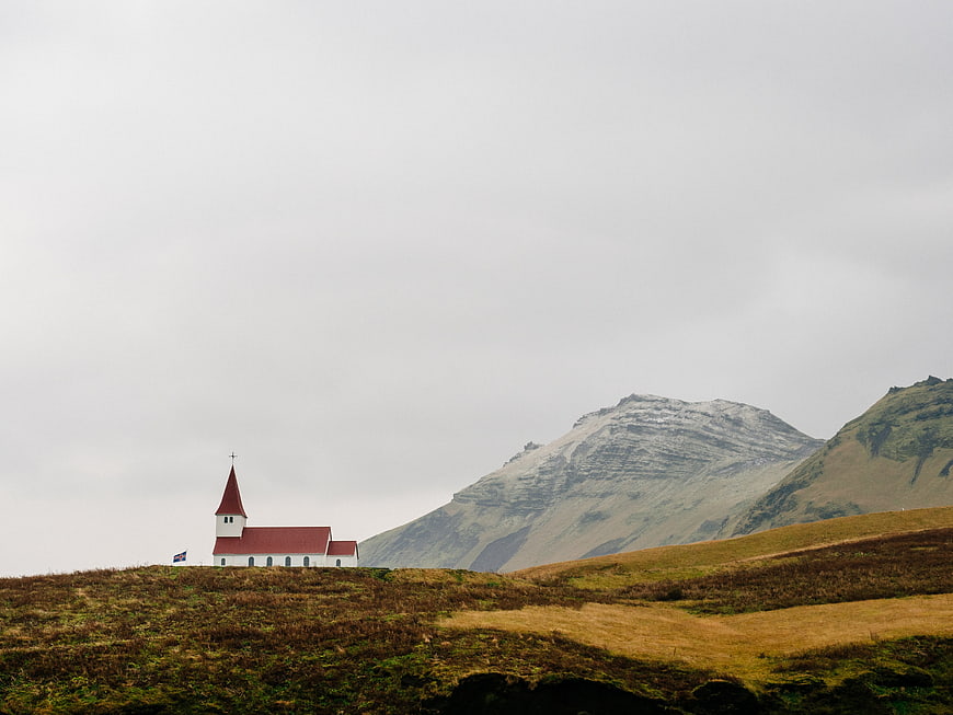 White Church with Red Roof in Icelandic Landscape