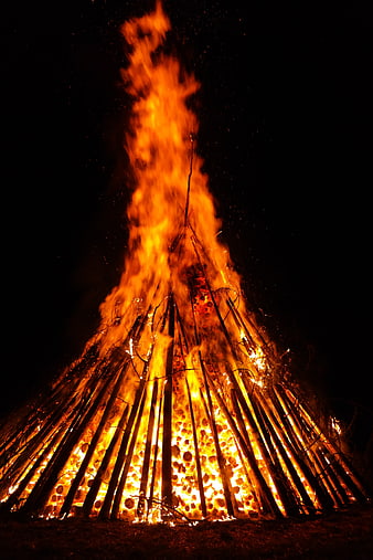 Large Bonfire Burning at Night with Sparks