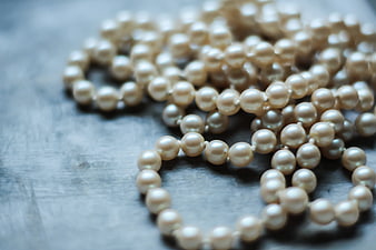 Vintage Pearl Beads on Textured Gray Surface