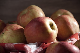 Fresh Red Apples on Red and White Checkered Cloth