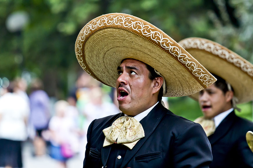 Mexican Mariachi Singer in Traditional Charro Suit and Sombrero
