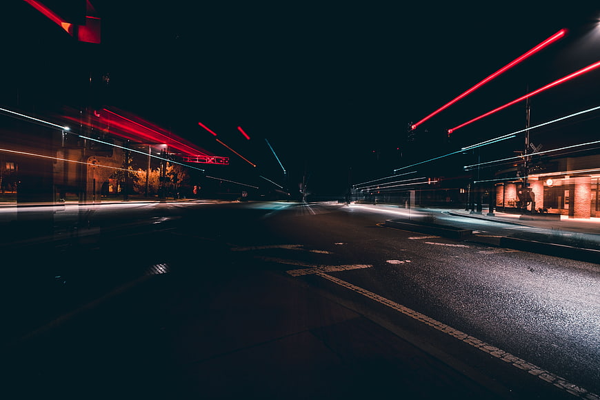 Long Exposure Night City Street with Red Light Trails