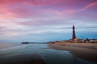 Blackpool Tower and Pier at Sunset on Sandy Beach