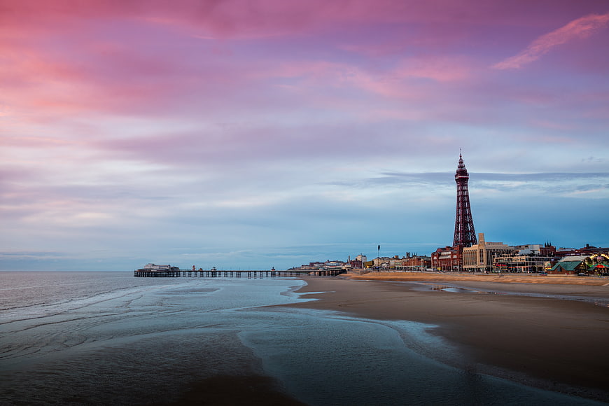 Blackpool Tower and Pier at Sunset on Sandy Beach