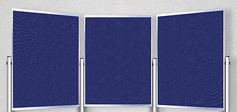 Three empty blue presentation boards on metal stands against a textured wall