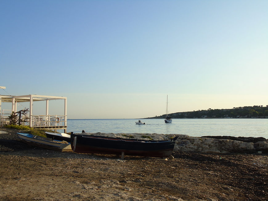 Traditional wooden boats on a rocky Mediterranean beach