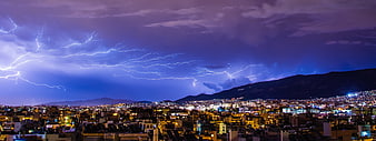 Panoramic Night Cityscape with Dramatic Lightning Storm