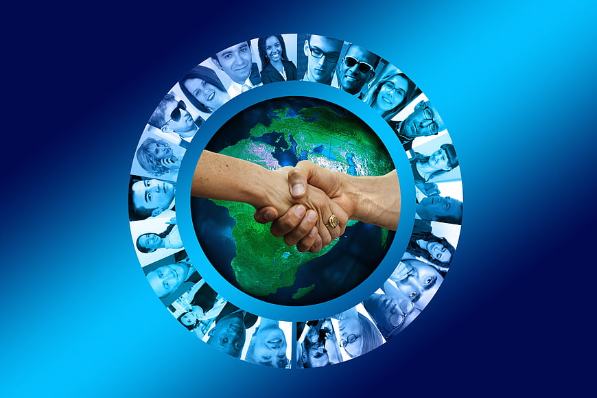 Global Business Collaboration Concept With Handshake And World Map
