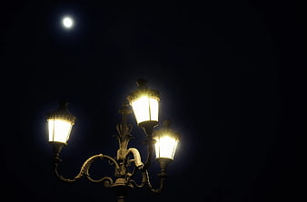 Vintage Street Lamp Illuminated at Night with Moon