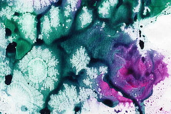 Abstract watercolor texture with teal, purple, and white splashes
