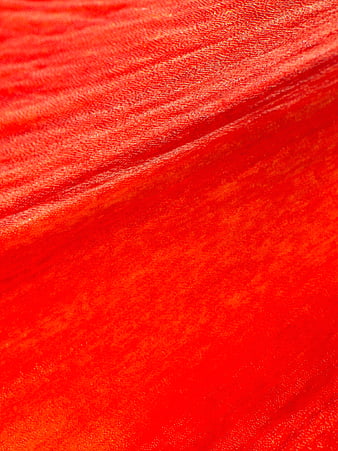Close-up of vibrant red velvet fabric texture