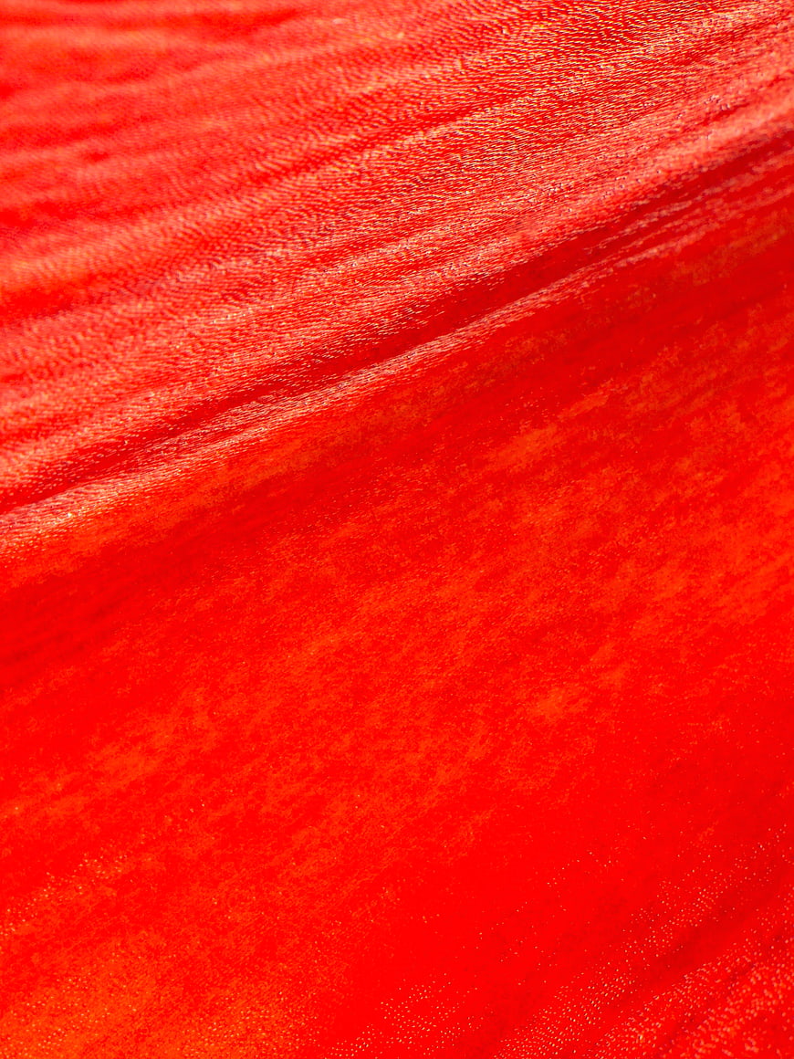 Close-up of vibrant red velvet fabric texture