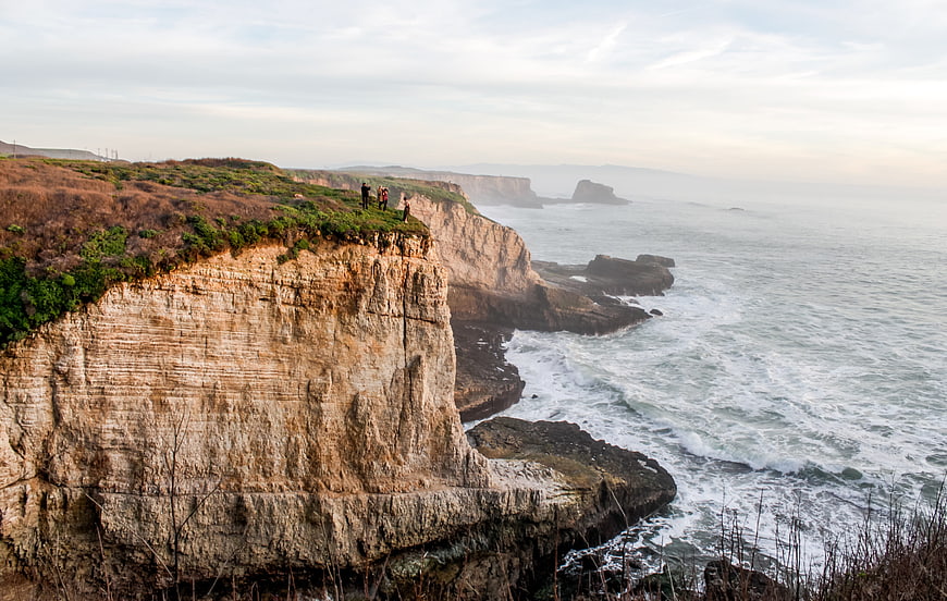 Dramatic Coastal Cliffs with Ocean View and Hikers